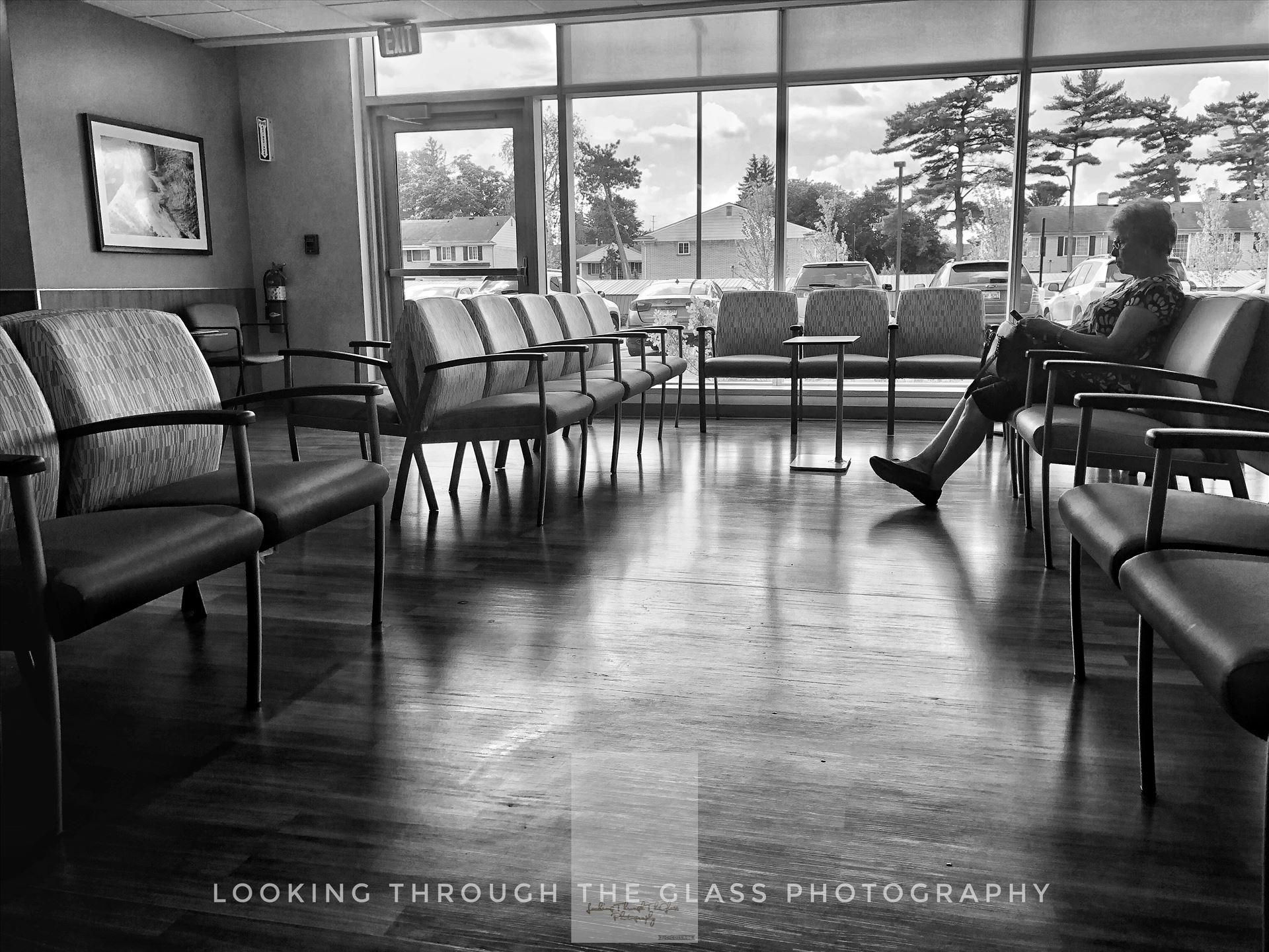 By Her LonesomeSilhouette of a woman down in black and white in a hospital waiting room. 